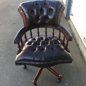 Captains chair in brown top grain leather and pecan antique finish to match the Presidents desk, hand made