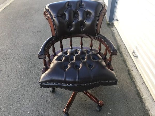 Captains chair in brown top grain leather and pecan antique finish to match the Presidents desk, hand made