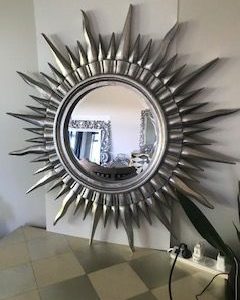 Louis XV Sunburst beveled glass mirror in silver leaf finish hand carved